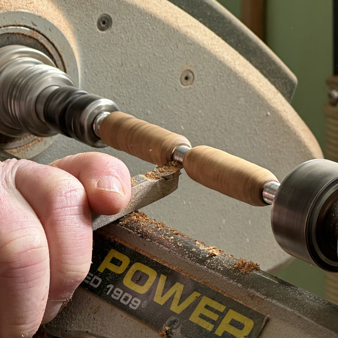 Reclaimed wooden pen barrels being lathed