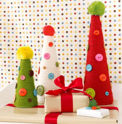 Image: handmade Christmas decorations: cones wrapped in wool with button decorations and pom pom on top